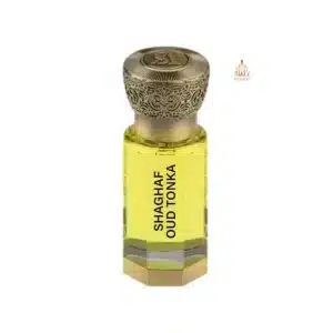Flacon d'huile de parfum jaune Shaghaf Oud Tonka Swiss Arabian avec bouchon en bronze gravé.