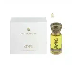 Flacon d'huile de parfum jaune Shaghaf Oud Tonka Swiss Arabian avec bouchon en bronze gravé.